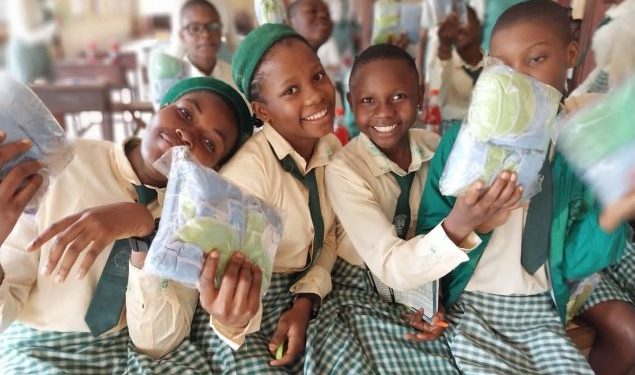 Rotary Clubdonates sanitary reusable sanity pads to secondary school girls